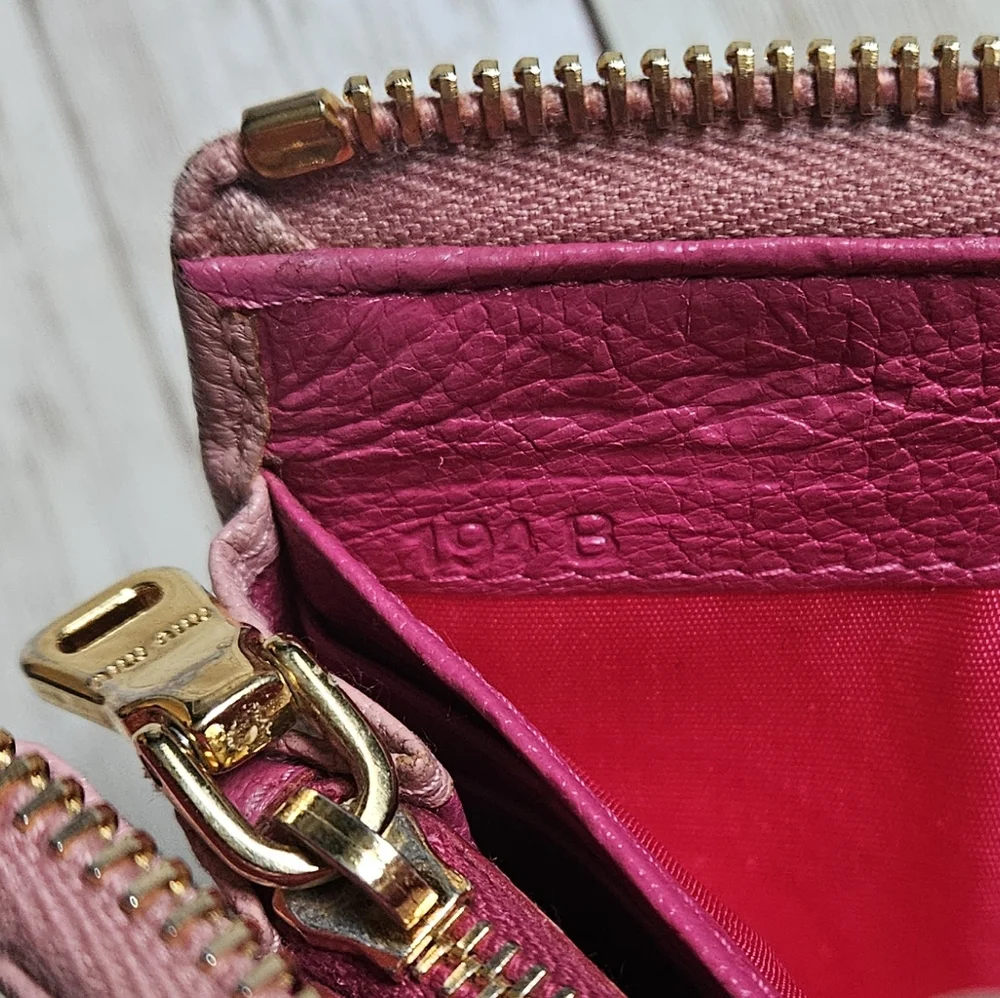 Miu Miu Pink Wallet with Elegant Zip Closure